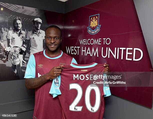 Victor Moses poses after signing for West Ham United on a season-long loan at West Ham United's training ground, Chadwell Heath Romford on September...