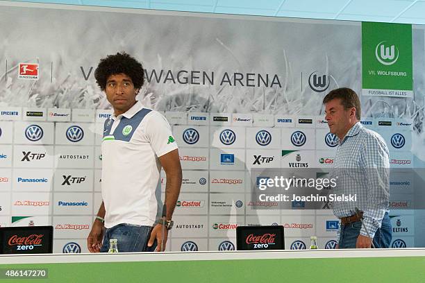 Dante and Head Coach Dieter Hecking arrice for a press conference at Volkswagen Arena on September 1, 2015 in Wolfsburg, Germany.