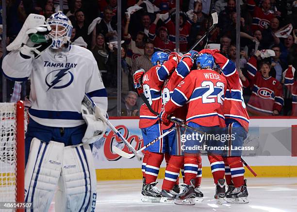 Daniel Briere of the Montreal Canadiens celebrates with teammates Dale Weise, Michael Bournival and Francis Bouillon after scoring a goal on Anders...