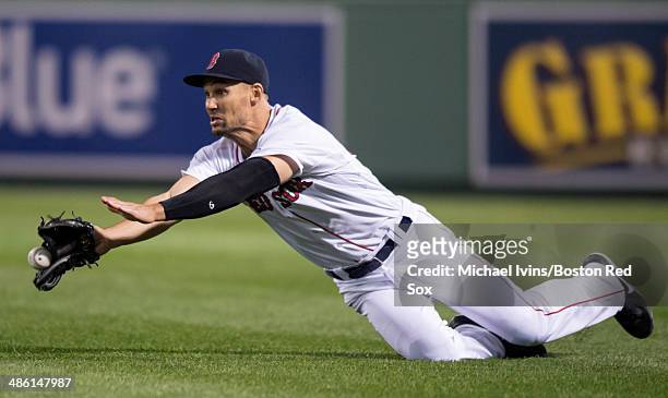 Grady Sizemore of the Boston Red Sox dives but can't come up with a ball off the bat of Brian McCann of the New York Yankees in the fourth inning at...