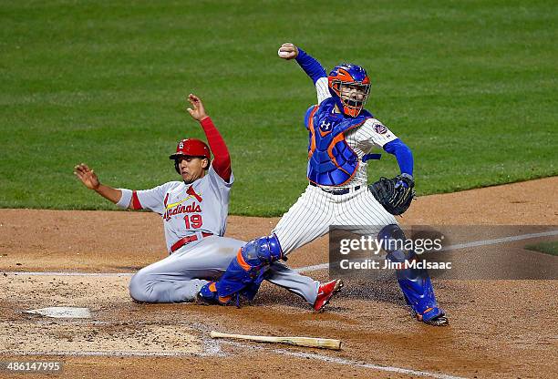 Jon Jay of the St. Louis Cardinals slides into Travis d'Arnaud of the New York Mets as he attempts a fourth inning double play by throwing to first...