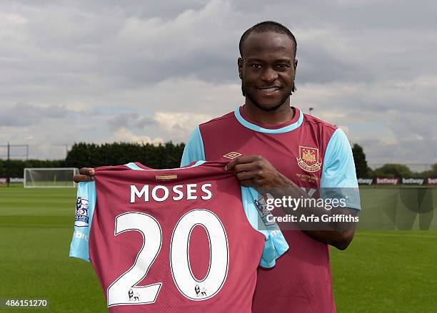 Victor Moses poses after signing for West Ham United on a season-long loan at West Ham United's training ground, Chadwell Heath Romford on September...