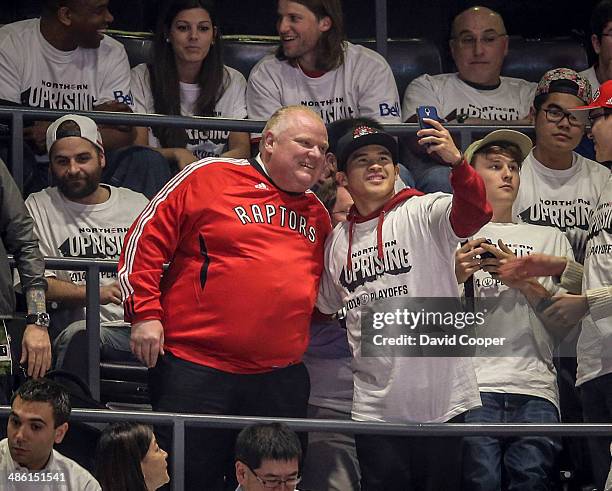 Toronto Mayor Rob Ford sits in section 318 six rows from the top of the building during game two between the Toronto Raptors and the Brooklyn Nets at...