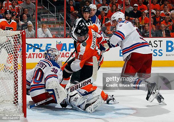 Henrik Lundqvist of the New York Rangers makes the second period stop on Scott Hartnell of the Philadelphia Flyers in Game Three of the First Round...