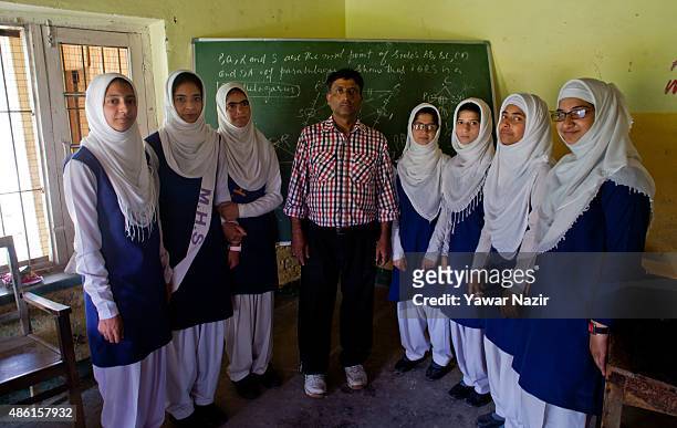 Javaid Ahmadwho, a teacher without a disability, poses with a group of deaf and mute students at Abhedananda Home, a school for deaf, mute and blind...