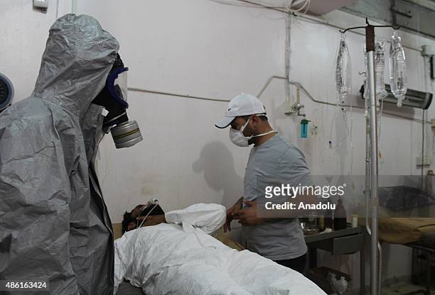 Wounded people receive treatment after Daesh terrorists' mustard gas attack in anti-regimist forces controlled Mari District of Aleppo, Syria on...