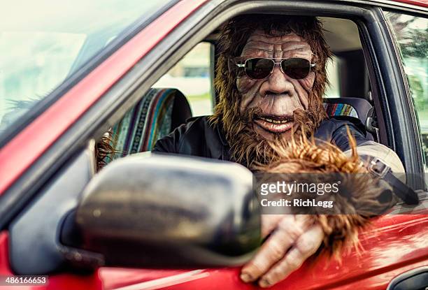 sasquatch road trip - caveman stock-fotos und bilder