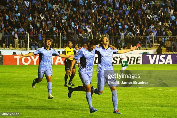 Luis Gutiérrez , Edemir Rodriguez and Nelson Cabrera of Bolívar celebrate the first goal of their team during a second round match between Bolivar...