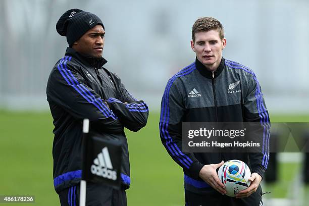 Waisake Naholo and Colin Slade stand on the sideline during a New Zealand All Blacks training session at Hutt Recreation Ground on September 2, 2015...