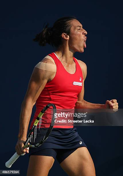 Francesca Schiavone of Italy reacts against Yanina Wickmayer of Belgium during their Women's Singles First Round match on Day Two of the 2015 US Open...