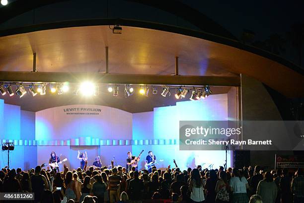 Amanda Sudano and Abner Ramirez of Johnnyswim perform at the Levitt Pavilion in Los Angeles, California stage on July 30, 2015.