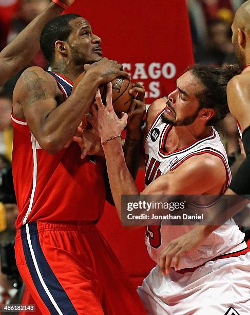 Joakim Noah of the Chicago Bulls forces a jump ball with Trevor Ariza of the Washington Wizards in Game Two of the Eastern Conference Quarterfinals...