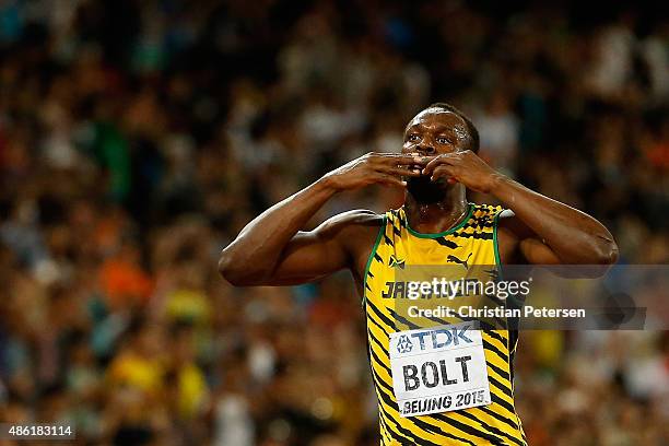 Usain Bolt of Jamaica celebrates after winning gold in the Men's 100 metres final during day two of the 15th IAAF World Athletics Championships...