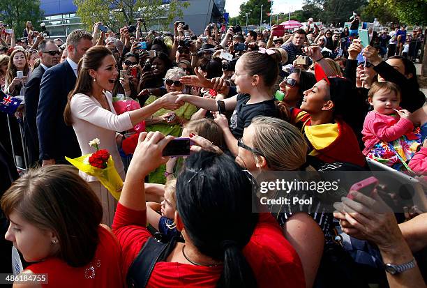 Catherine, Duchess of Cambridge greets members of the crowd with her husband Prince William, Duke of Cambridge, at the Playford Civic Centre in the...