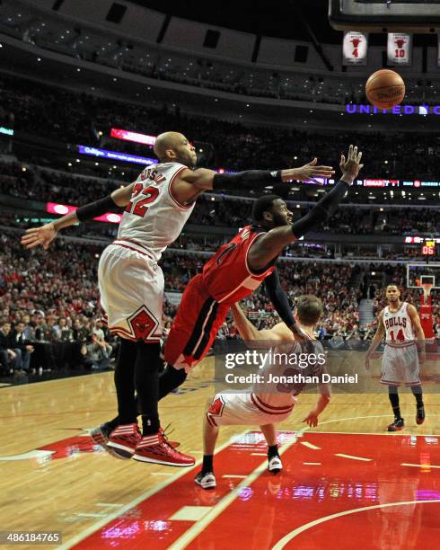 John Wall of the Washington Wizards shoots between Taj Gibson and Mike Dunleavy of the Chicago Bulls in Game Two of the Eastern Conference...