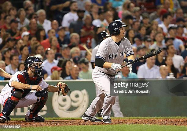 Stephen Drew of the New York Yankees knocks in two runs in the fifth inning against the Boston Red Sox at Fenway Park on September 1, 2015 in Boston,...