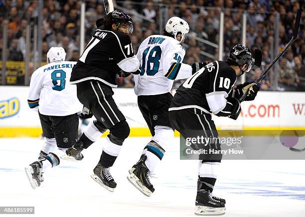 Joe Pavelski of the San Jose Sharks, Dwight King of the Los Angeles Kings, Mike Brown of the San Jose Sharks and Mike Richards of the Los Angeles...