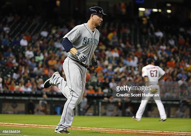 Mark Trumbo of the Seattle Mariners rounds the bases after his two-run home run in the fifth inning off Vincent Velasquez of the Houston Astros...