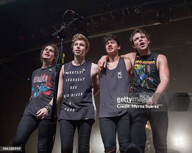 Michael Clifford, Luke Hemmings, Calum Hood, and Ashton Irwin of 5 Seconds Of Summer perform at the Best Buy Theater on April 22, 2014 in New York...