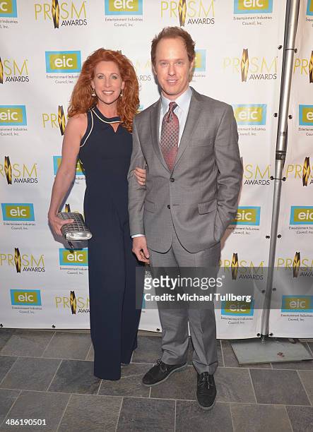 Actor Raphael Sbarge and guest attend the 18th Annual PRISM Awards Ceremony at Skirball Cultural Center on April 22, 2014 in Los Angeles, California.