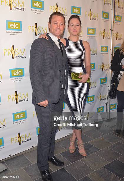 Actor Grant Bowler and guest attend the 18th Annual PRISM Awards Ceremony at Skirball Cultural Center on April 22, 2014 in Los Angeles, California.