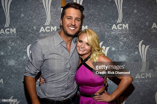 Luke Bryan and Miranda Lambert perform backstage during the 9th Annual ACM Honors at the Ryman Auditorium on September 1, 2015 in Nashville,...