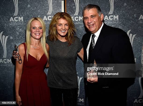 S Tiffany Moon, Marion Kraft, and ACM CEO Bob Romeo pose backstage during the 9th Annual ACM Honors at the Ryman Auditorium on September 1, 2015 in...