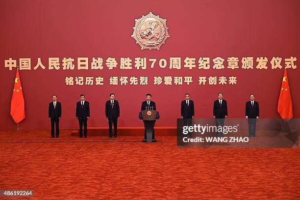 China's President Xi Jinping gives a speech during an awards ceremony marking the 70th anniversary of the end of World War II, at the Great Hall of...