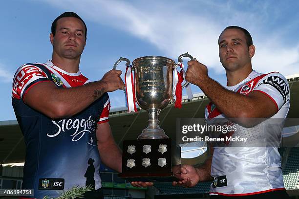 Roosters Boyd Cordner and Dragons Jason Nightingale hold the trophy during a St George Illawarra Dragons and Sydney Roosters NRL media opportunity...