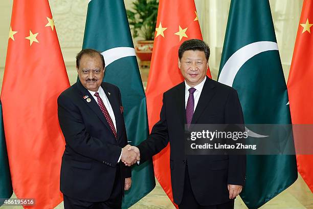 Chinese President Xi Jinping shankes hands with Pakistan President Mamnoon Hussain at The Great Hall Of The People on September 2, 2015 in Beijing,...