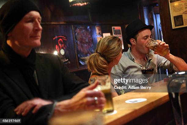 Patrons have drinks at the Alt Berlin bar on April 22, 2014 in Berlin, Germany. The bar, which opened in 1893 and is known for its familial...