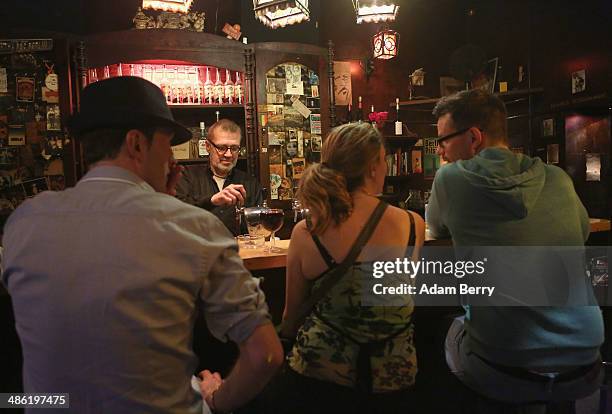 Patrons have drinks at the Alt Berlin bar on April 22, 2014 in Berlin, Germany. The bar, which opened in 1893 and is known for its familial...