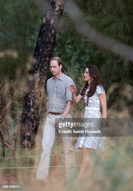 Prince William, Duke of Cambridge and Catherine, Duchess of Cambridge walk around Ayers Rock on April 22, 2014 in Ayers Rock, Australia. The Duke and...