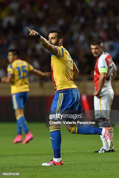 Alvaro Negredo of Valencia celebrates after scoring the opening goal during the UEFA Champions League qualifying round play off second leg match...
