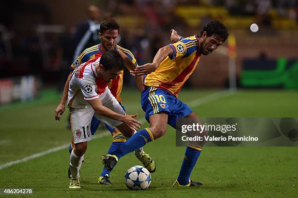 Daniel Parejo of Valencia competes with Bernardo Silva of Monaco during the UEFA Champions League qualifying round play off second leg match between...