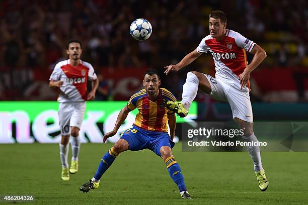 Mario Pasalic of Monaco controls the ball against Javi Fuego of Valencia during the UEFA Champions League qualifying round play off second leg match...