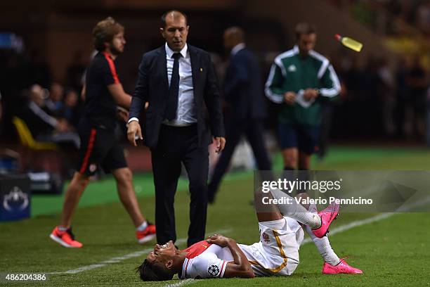 Nabil Dirar of Monaco lies injured during the UEFA Champions League qualifying round play off second leg match between Monaco and Valencia on August...