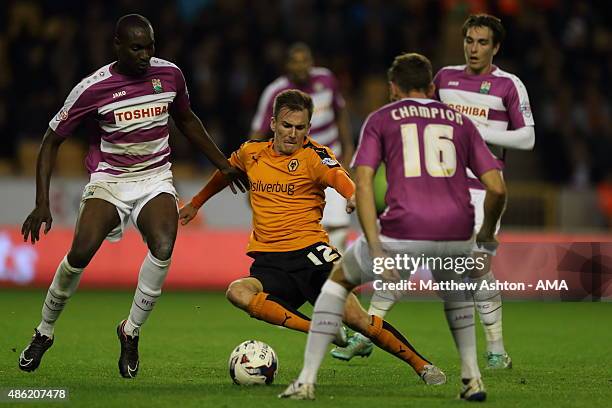 Jed Wallace of Wolverhampton Wanderers get crowded out by Barnet players during the Capital One Cup match between Wolverhampton Wanderers and Barnet...