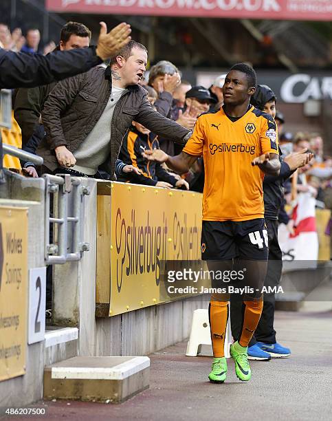 Bright Enobakhare of Wolverhampton Wanderers celebrates with the fans after scoring a goal to make it 1-0 during the Capital One Cup match between...