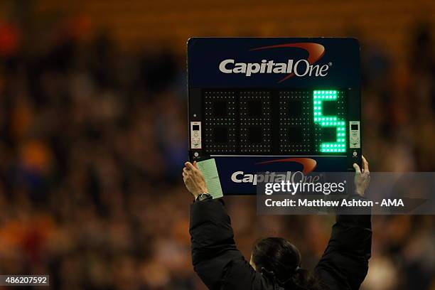 Board showing 5 minutes of added time during the Capital One Cup match between Wolverhampton Wanderers and Barnet at Molineux on August 25, 2015 in...