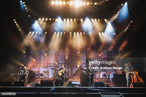 Ben Lovett, Marcus Mumford, Winston Marshall and Ted Dwane of Mumford and Sons performs on the main stage at Leeds Festival at Bramham Park on August...