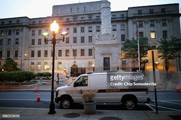 Sheriff's vehicle stands parked across the street from the Baltimore City Circuit Courthouse East where pre-trial hearings will be held for six...