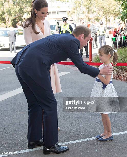 Catherine, Duchess of Cambridge looks on as Prince William, Duke of Cambridge meets six year old Lauren Stepherson during their visit to Elizabeth on...