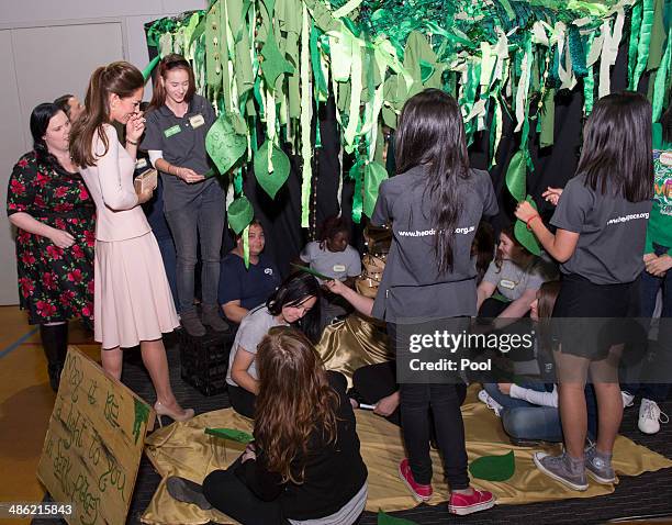 Catherine, Duchess of Cambridge ties on a leaf to the Mental Health Tree during her visit to the youth community centre, The Northern Sound System,...