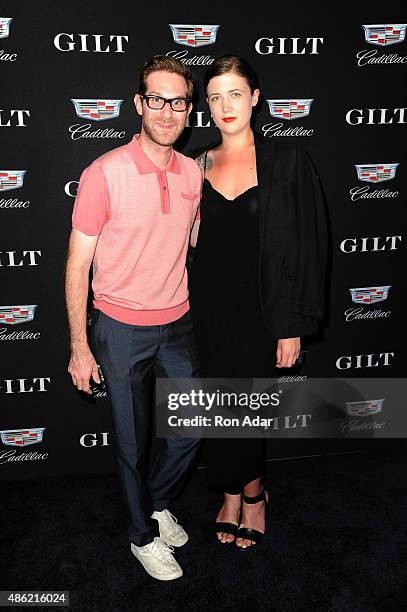 Designer David Hart and Shelby Christensen attend the Cadillac Capsule Clothing Collection Launch at Classic Car Club on September 1, 2015 in New...