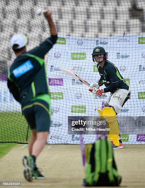 Australia's fielding coach Greg Blewett throws a few balls for captain Steve Smith during an Australia nets session at Ageas Bowl on September 2,...