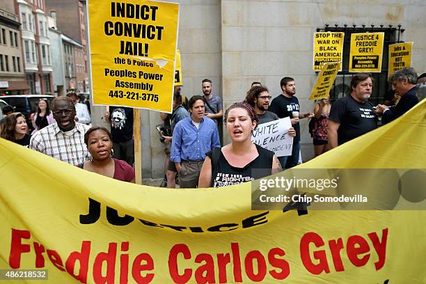 Small and peaceful group of demonstrators gather to protest in front of the Baltimore City Circuit Courthouse East where pre-trial hearings will be...