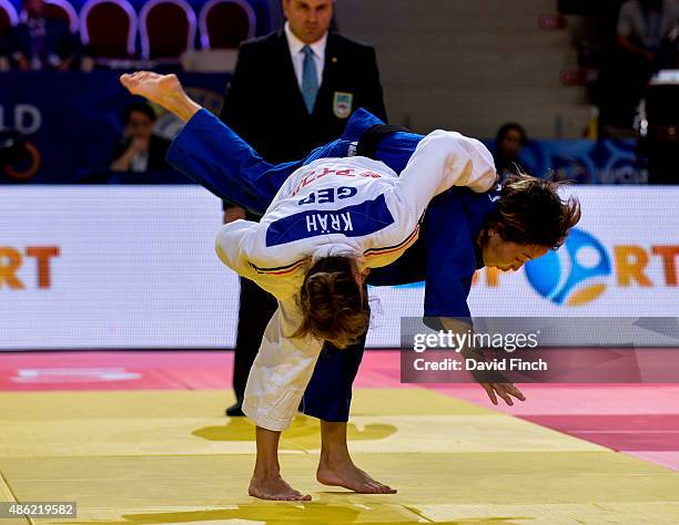 World champion, Urantsetseg Munkhbat of Mongolia is stunned after being thrown for an ippon by Mareen Kraeh of Germany. Eventually the German team...