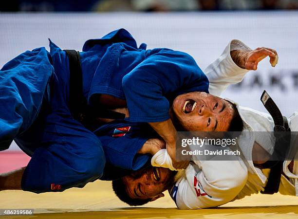 Otgonbaatar Lkhagvasuren of Mongolia throws Beka Gviniashvili of Georgia for a yuko but the Georgian fought back to win the match by ippon with...