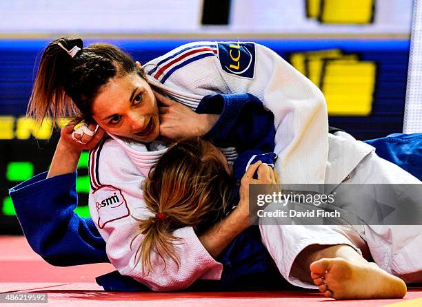 Automne Pavia of the French team defeated Tatiana Kazenyuk of Russia by an ippon with a hold during the 2015 Astana World Judo Team Championships at...